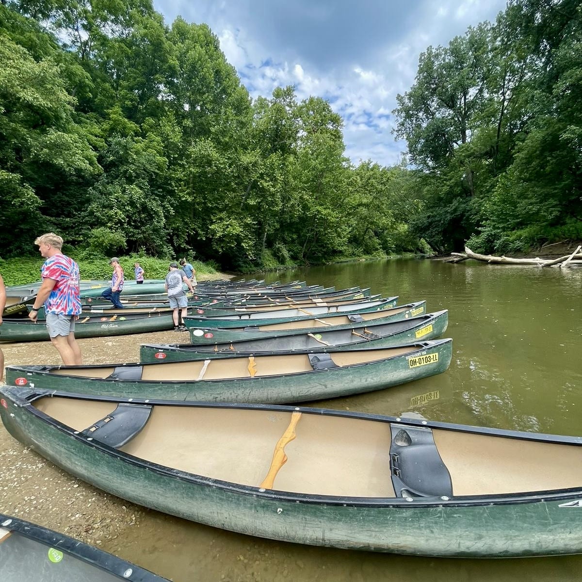Canoes lined up and ready for people to use on the Hocking River